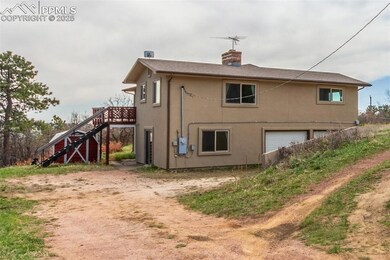 This is the back of the home; however it does face the road. One of two storage sheds.
