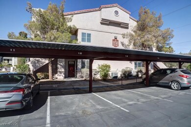 View of parking / parking lot with a carport