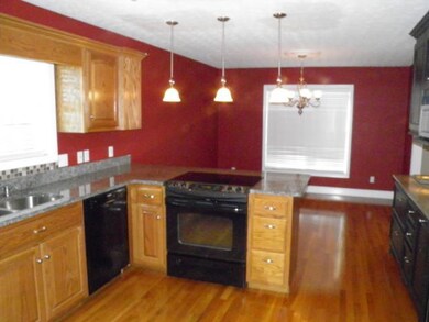 Alternate view of the kitchen.  Lighting in the kitchen has been upgraded, and there is an electric water heater under the sink for instant hot water.  