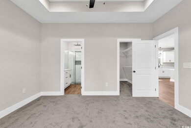 Unfurnished bedroom featuring carpet floors, a spa