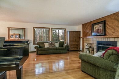 Living room wall-of-windows brings the serene outd