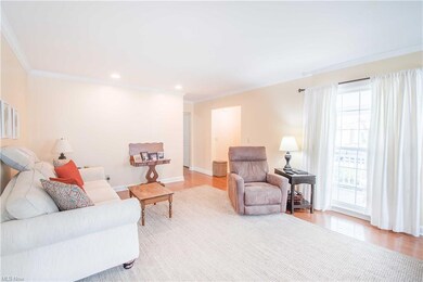 The living room with beautiful hardwood floors and