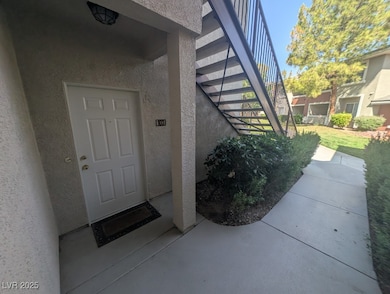 Property entrance featuring stucco siding