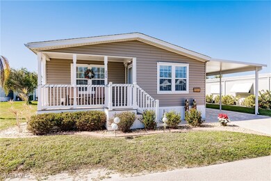 Home with a front yard and a carport