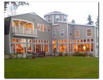 Twilight with warmly lighted living...