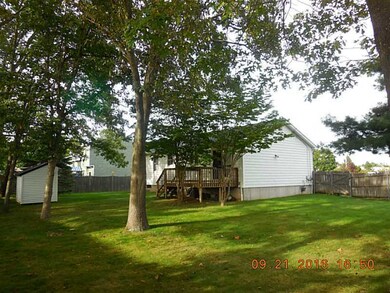 Exterior Back. View of rear yard and shed.