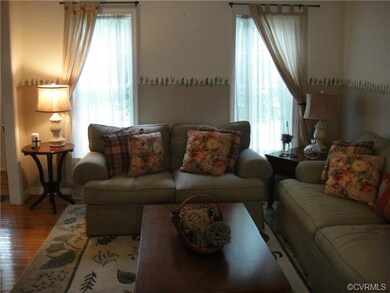 Living Room with windows looking toward front of h