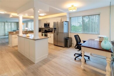 Kitchen featuring white cabinets, stainless steel 