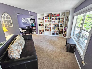 Family room, with custom built bookcases, from entry.