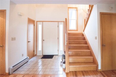 Foyer off front door with guest closet