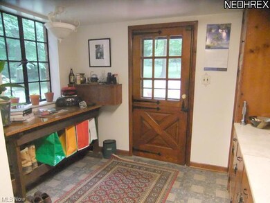 Mudroom area off the kitchen with door leading to 