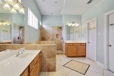 Master bath has 2 sinks, separate tile shower, hyd
