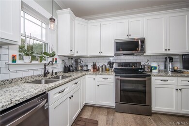kitchen space; complete with stainless steel appli