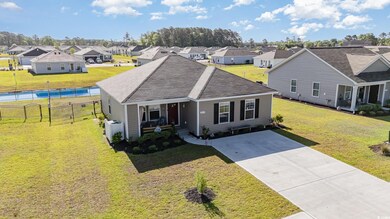 View of front facade with fence, a front yard, a s