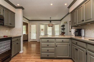 Another view of the kitchen and breakfast room wit