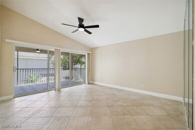 Empty room featuring lofted ceiling, baseboards, l