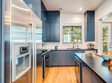 Kitchen featuring stainless steel appliances, a s