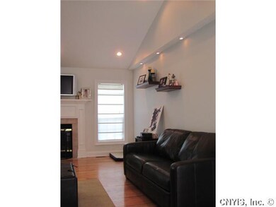 Living Room. Windows on both sides of the fireplac
