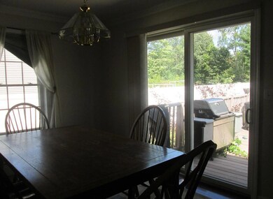 Bright and sunny dining room leads...