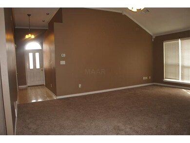 View of the great room and entry from the dining r