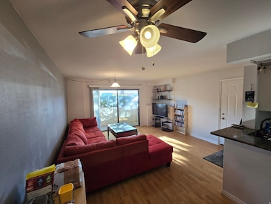 Living room with wood finished floors and baseboards