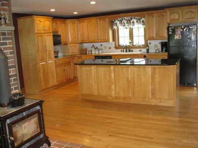 Kitchen w/ custom maple cabinets and...