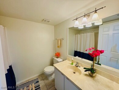 Bathroom with tile patterned flooring, vanity, a s