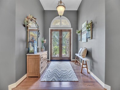 Double stained glass doors provide natural light s