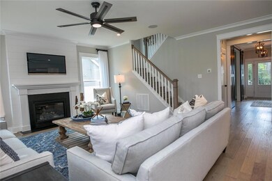 The first floor offers a large dining room with board and batten trim. The office has a closet and barn doors. Hardwoods throughout most of the downstairs. Spacious first floor guest suite. DESIGNER Kitchen with huge quartz island and walk-in pantry.