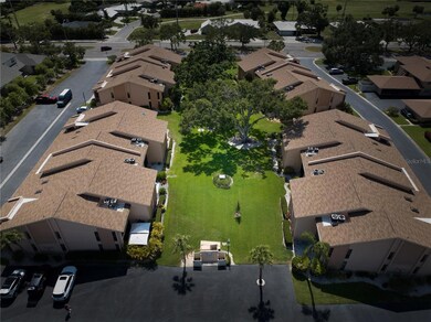 The complex. The unit is the lower right with the outside area of umbrellas and palm trees.