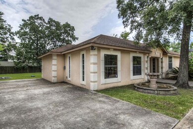 Large drive way to the left of the home, looking to the backyard.