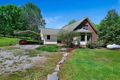 Side and back view with carport