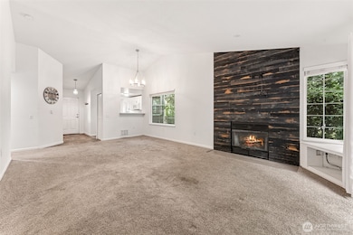 Living room w/ cozy wood burning fireplace.