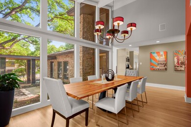 Sunroom / solarium featuring a chandelier