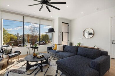 Living area with light wood-type flooring, ceilin
