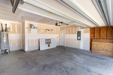 Garage with electric water heater and electric panel