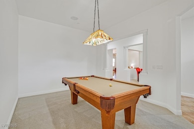 Playroom featuring light carpet, baseboards, and p