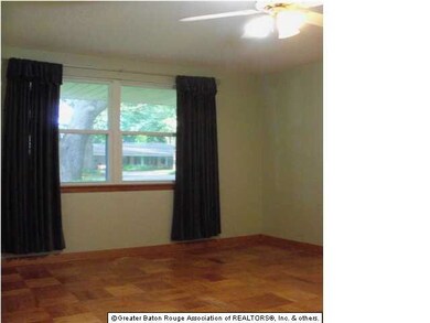 The middle bedroom also looks out onto the front y