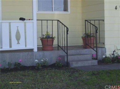 Decorative rod iron railing goint up the front ste