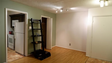 Entrance/dining space with updated light fixtures