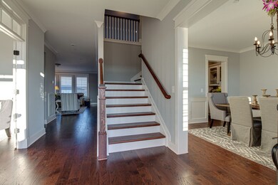 The home features hardwood floors in all living spaces, with tile in all bathrooms and laundry. The entry way is welcoming and open to the formal dining room.