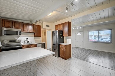 Kitchen with stainless steel appliances, visible v