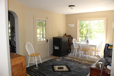 Dining room featuring healthy amount of natural light and arched walkways