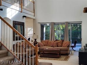 Living room featuring a high ceiling
