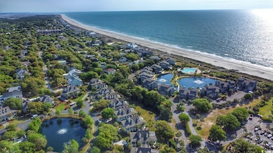 Aerial view featuring a water view, a view of the beach, and a residential view