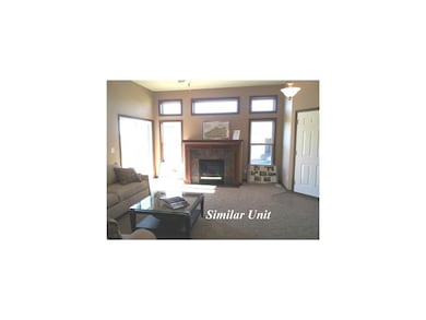 Living Room. Picture is of similar unit.