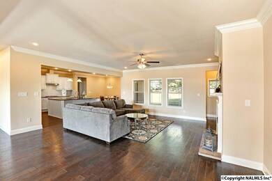 A perfect space with so many possibilities!  Open space, crown molding, ventless natural gas fireplace with stacked stone, and beautiful hardwood flooring. All the makings for a special space to call home.
