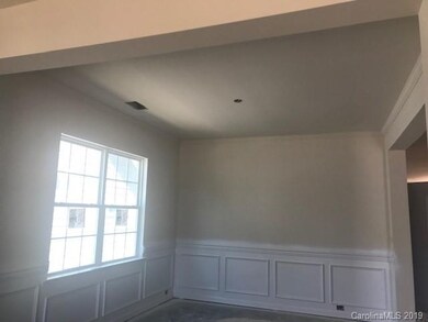 Chair rail and molding being added in the Dining R