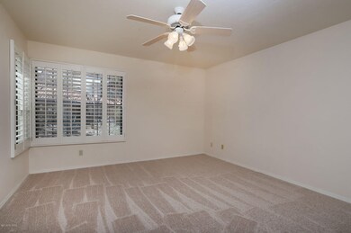 Downstairs bedroom w Plantation shutters