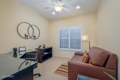 Den separates main and guest bedrooms